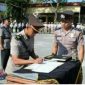 Suasana saat apel sertijab empat perwira di halaman Mapolres Pati.