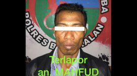 Tersangka MD saat di amankan di Mapolres Bangkalan.