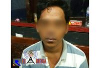 Tersangka FY saat diamankan di Mapolres Bangkalan.