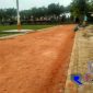Tampak pekerja tengah memperbaiki lintas lari atletik di Lapangan Wijaya Sampang.