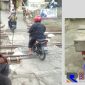 Kang Bencoy tengah meratapi hilir mudik para pengendara yang melintas diperlintasan kereta api yang dijaganya.