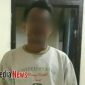 Tersangka AZ saat diamankan di Mapolsek Kamal, Bangkalan.