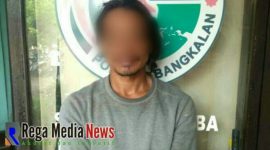 Tersangka MR, saat diamankan di Mapolres Bangkalan.