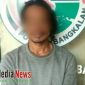 Tersangka MR, saat diamankan di Mapolres Bangkalan.
