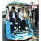 Presiden RI (Joko Widodo) tengah menaiki bentor bersama dengan ibu negara (Iriana).