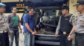 Tersangka ASD diamankan pihak kepolisian. 