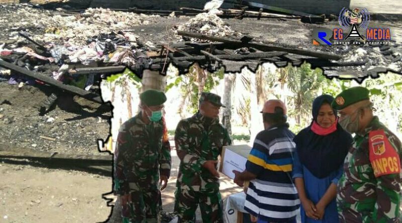 Dandim 1314/Gorontalo Utara saat memberikan bantuan kepada korban kebakaran. 