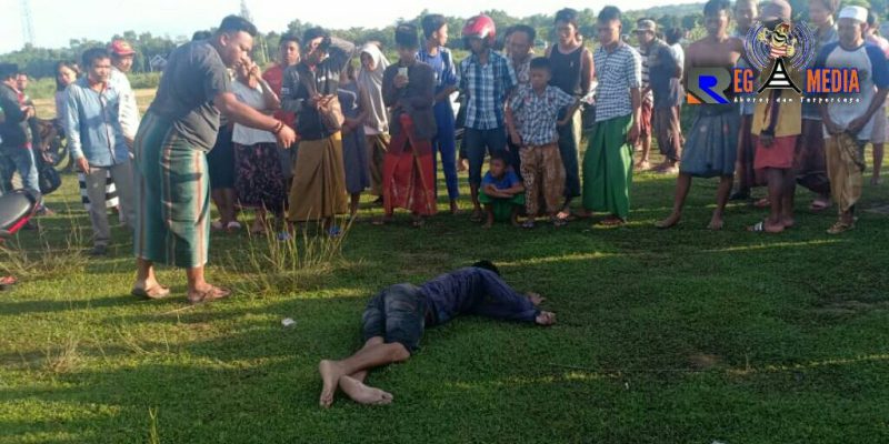 Jasad korban (SF) terkapar di lapangan Lengser, Desa Dharma Camplong, Kecamatan Camplong, Sampang. (TKP, red).