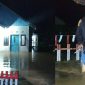 Kepala Desa Milango (Eman Kadir); terlihat rumah warga terendam banjir. 