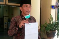 Wakil Ketua DPRD Bangkalan (Hosyan Muhammad) saat menunjukkan hasil swab test_nya.