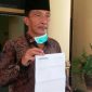 Wakil Ketua DPRD Bangkalan (Hosyan Muhammad) saat menunjukkan hasil swab test_nya.