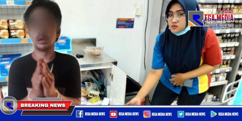 Tersangka BS saat diamankan polisi, tampak karyawan Indomaret menunjukkan tempat penyimpanan rokok yang dibobol.