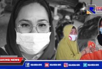 Anggota DPD RI Dapil Provinsi Gorontalo (Dewi Sartika Hemeto) saat menyerahkan paket sembako kepada salah satu penerima di Kecamatan Dungingi, Kota Gorontalo.