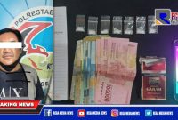Caption: tersangka inisial HK dan barang buktinya diamankan di Mapolrestabes Surabaya.