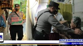 Caption: anggota Polsek Tambaksari Surabaya saat door to door memberikan bantuan sembako ke warga kurang mampu.