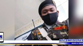 Caption: Kepala Satuan Koordinasi Rayon (Satkoryon) Banser Kenjeran Surabaya (Rio Gunawan).