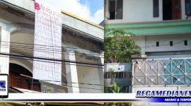 Caption: bangunan rumah milik oknum karyawan Pelni yang dipasangi spanduk.