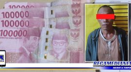 Caption: tersangka inisial (MJ) dan barang buktinya saat diamankan di Mapolsek Tambaksari Surabaya.