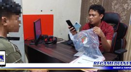 Caption: tersangka inisial (FT) saat di interogasi penyidik Polres Gorontalo Kota.