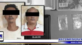 Caption: dua tersangka inisial (EY) dan (TDK) serta barang buktinya saat diamankan di Mapolres Pelabuhan Tanjung Perak Surabaya.