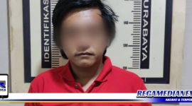 Caption: tersangka inisial (MNR) saat diamankan di Mapolsek Asemrowo Surabaya.