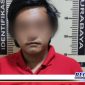 Caption: tersangka inisial (MNR) saat diamankan di Mapolsek Asemrowo Surabaya.