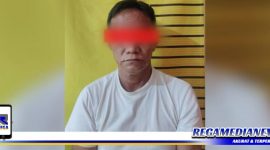 Caption: tersangka inisial (TM) saat diamankan di Mapolsek Tambaksari Surabaya.