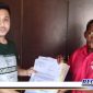 Caption: tersangka inisial (RY) saat menerima berkas penahanan terhadap dirinya.