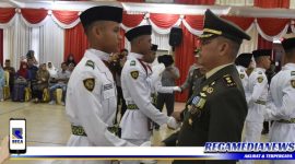 Caption: Pengukuhan anggota Paskibraka oleh Dandim 0107 Aceh Selatan.