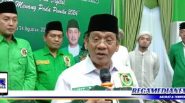 Caption: Wakil Ketua DPW PPP Jawa Timur (KH. Mujahid Ansori), saat diwawancara awak media.
