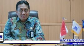 Caption: Rektor UTM (Drs. Ec. H. Muh. Syarif M. Si.)