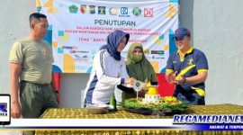 Caption: HUT Ke-2, potong tumpeng pertama diberikan kepada Ketua IWO Pamekasan (Heny Dyah A).