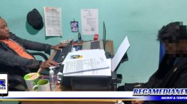 Caption: tersangka kasus narkotika saat diperiksa penyidik Satresnarkoba, (Doc: Humas Polres Gorontalo Kota).