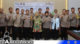 Caption: Kepala BPJS Ketenagakerjaan Madura pose bersama Polres Bangkalan.