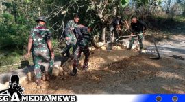 Caption: Satgas TMMD Sampang bergotong royong mengerjakan pembangunan betonisasi di Desa Pasarenan, (dok. regamedianews). 