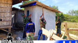Caption: personel Satgas TMMD Kodim 0828 Sampang tampak melakukan pengecatan tembok MCK, (dok. regamedianews). 