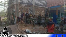 Caption: semangat Satgas TMMD Kodim 0828 Sampang melanjutkan pembangunan ruang guru SDN Pasarenan 2, (dok. regamedianews).