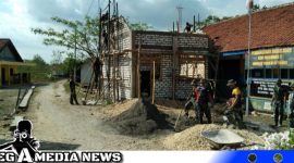 Caption: semangat Satgas TMMD membangunan ruang guru SDN Pasarenan 2, (dok. regamedianews).