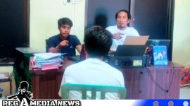 Caption: tersangka penggelapan mobil inisial ZA saat diinterogasi penyidik Satreskrim Polres Sampang, (dok. regamedianews). 