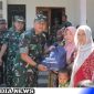 Caption: penyerahan bansos berupa paket sembako kepada warga di lokasi TMMD ke-117, (dok. regamedianews). 