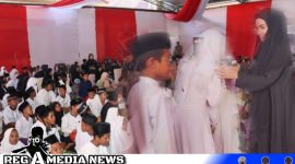 Caption: Ketua Bhayangkari Jawa Timur saat memberikan santunan kepada anak yatim, di Mako Polres Sampang, (dok. regamedianews). 