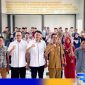 Caption: BPJS Ketenagakerjaan Madura pose bersama pihak DPMD Bangkalan, (dok. regamedianews). 