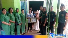 Caption: Dandim Gorut saat menyambangi salah satu balita di Desa Pontolo, dalam program stunting, (dok. regamedianews). 