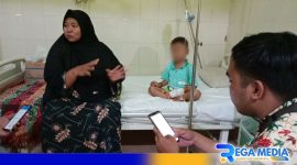 Caption: pasien dan neneknya saat ditemui awak media, di Puskesmas Kamoning Sampang, (dok. regamedianews). 