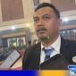 Caption: Ketua KPU Bangkalan Sairil Munir saat diwawancara awak media, (dok. regamedianews). 