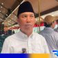 Caption: Sekretaris Asosiasi Kepala Desa Bangkalan, Jayus Salam, saat diwawancara awak media, (dok. regamedianews). 