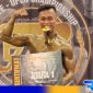 Caption: Regal pose gigit medali usai terima juara 1 Fitlife Open Championship, (dok. regamedianews). 