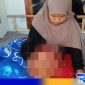 Caption: Siti Qomariyah, harus menahan derita penyakit kanker ganas dibagian kakinya, (dok. regamedianews). 