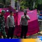 Caption: petugas kepolisian berada di lokasi pemakaman saat berlangsungnya ekshumasi, (dok. regamedianews). 