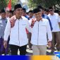 Caption: Paslon Bupati dan Wabup Bangkalan Lukman Hakim dan Moch Fauzan Ja'far, diiringi pendukung dan relawan, (dok: regamedianews).